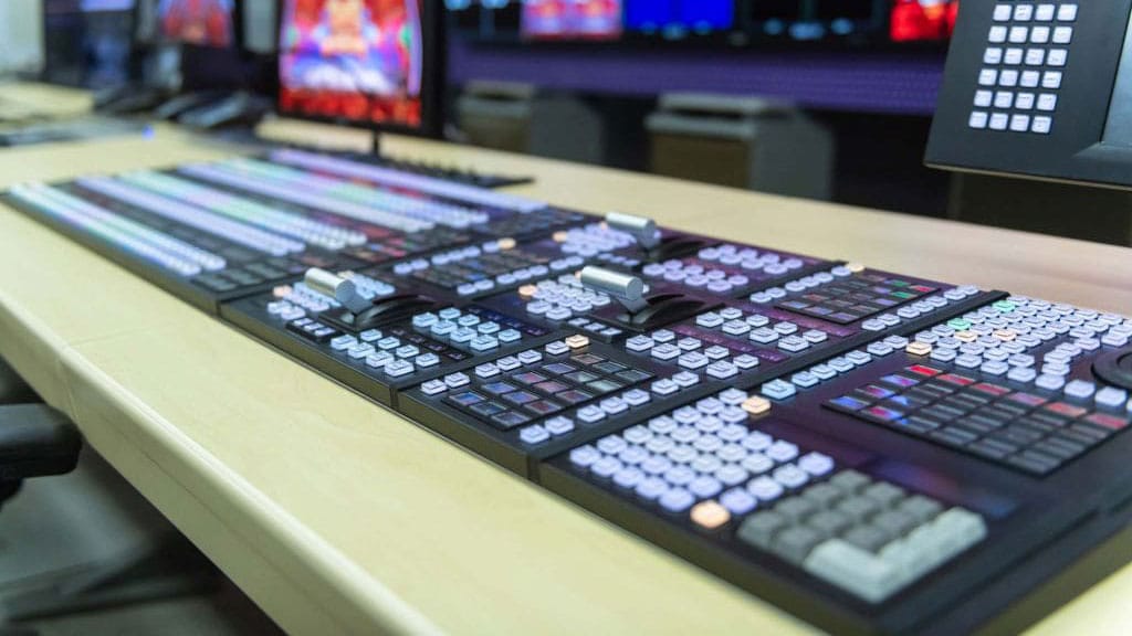 A mixing desk forms part of a professional Audio Visual Solution